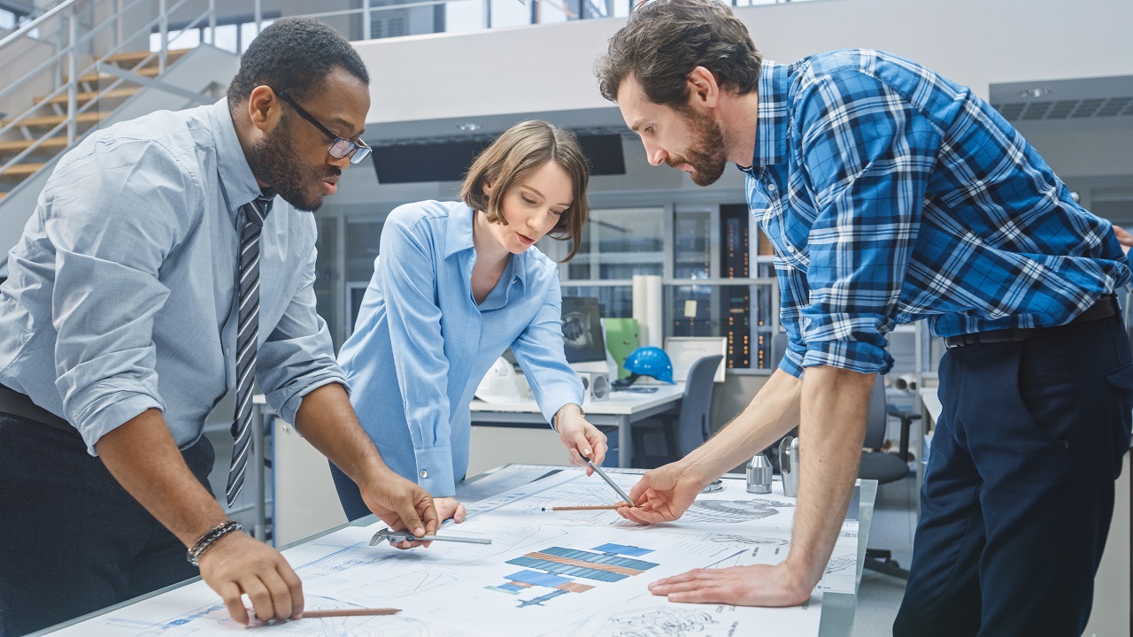 Engineers looking at a drawing